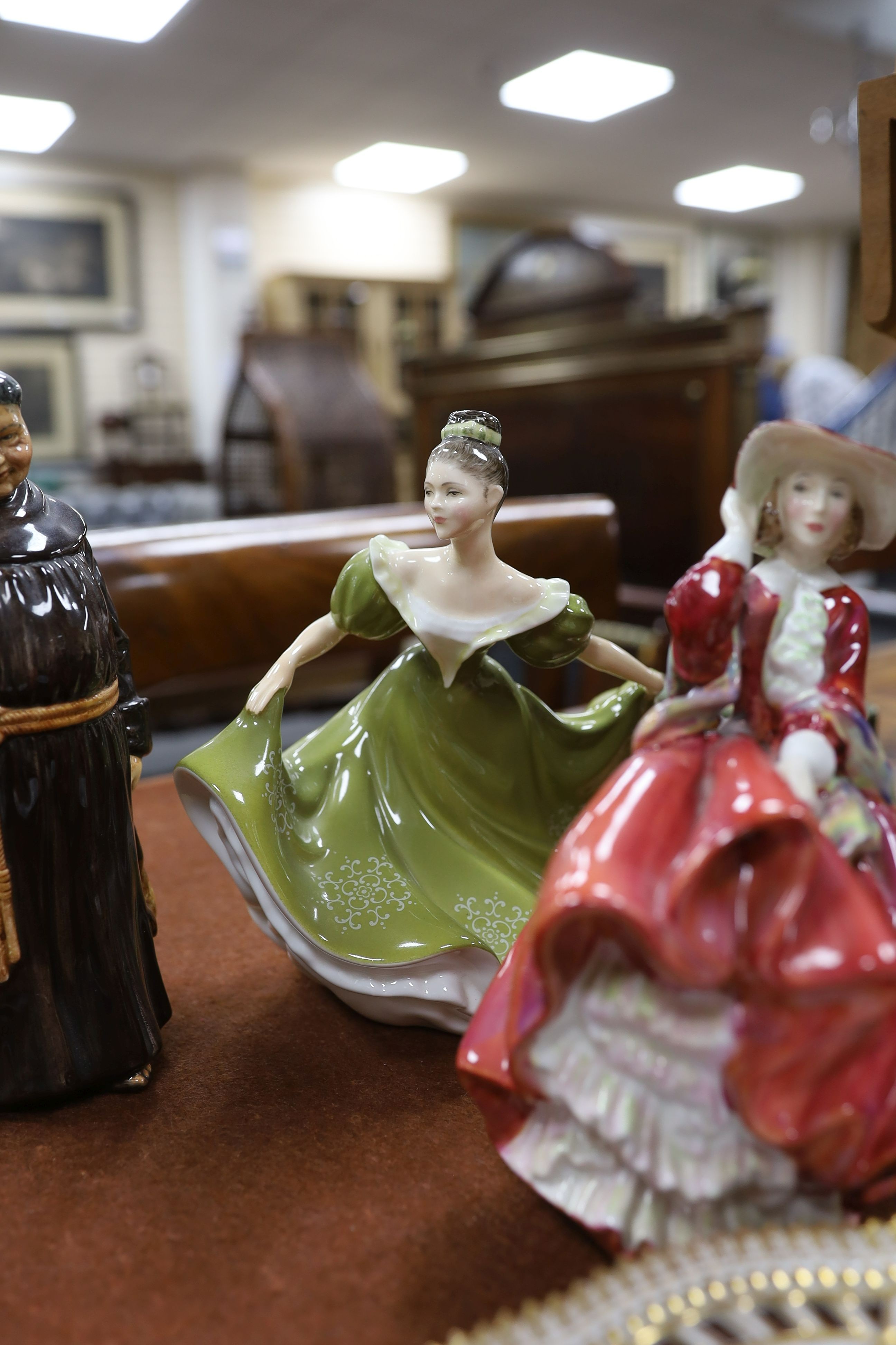 A Copenhagen porcelain botanical plate 'Prisspuria', a Beswick rearing horse huntsman and three Doulton figures (5)